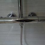 Wall mounted thermostatic shower controller