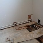 Bathroom water pipe hidden below floor level