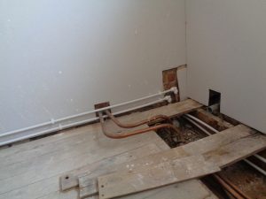 Bathroom water pipe hidden below floor level