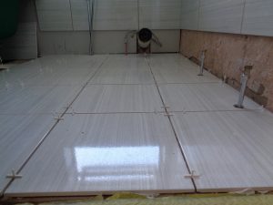 Bathroom Heating pipes in chrome comming from the floor