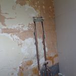 Shower pipes hidden in wall which will later be tiled