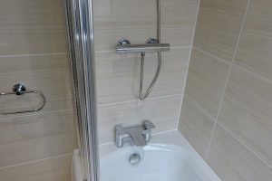 Bathroom fitted with Tavistock Strike with bath mixer taps