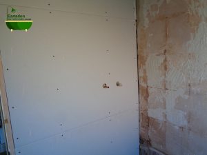Hot and cold water shower feeds buried and hidden in bathroom wall behind the plaster board