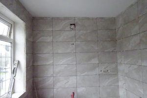 Fully tiled ensuite bathroom walls