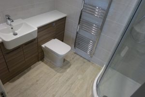 Ensuite with fitted furniture and quadrant shower