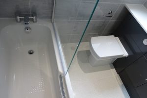 Bathroom with Trojan cast reinforced shower bath