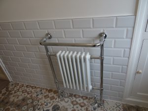 traditional style towel radiator fitted on metro tiles