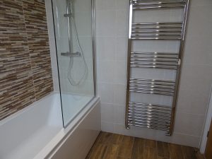 Bathroom Warwick with Trojan cast bath and chrome towel warmer