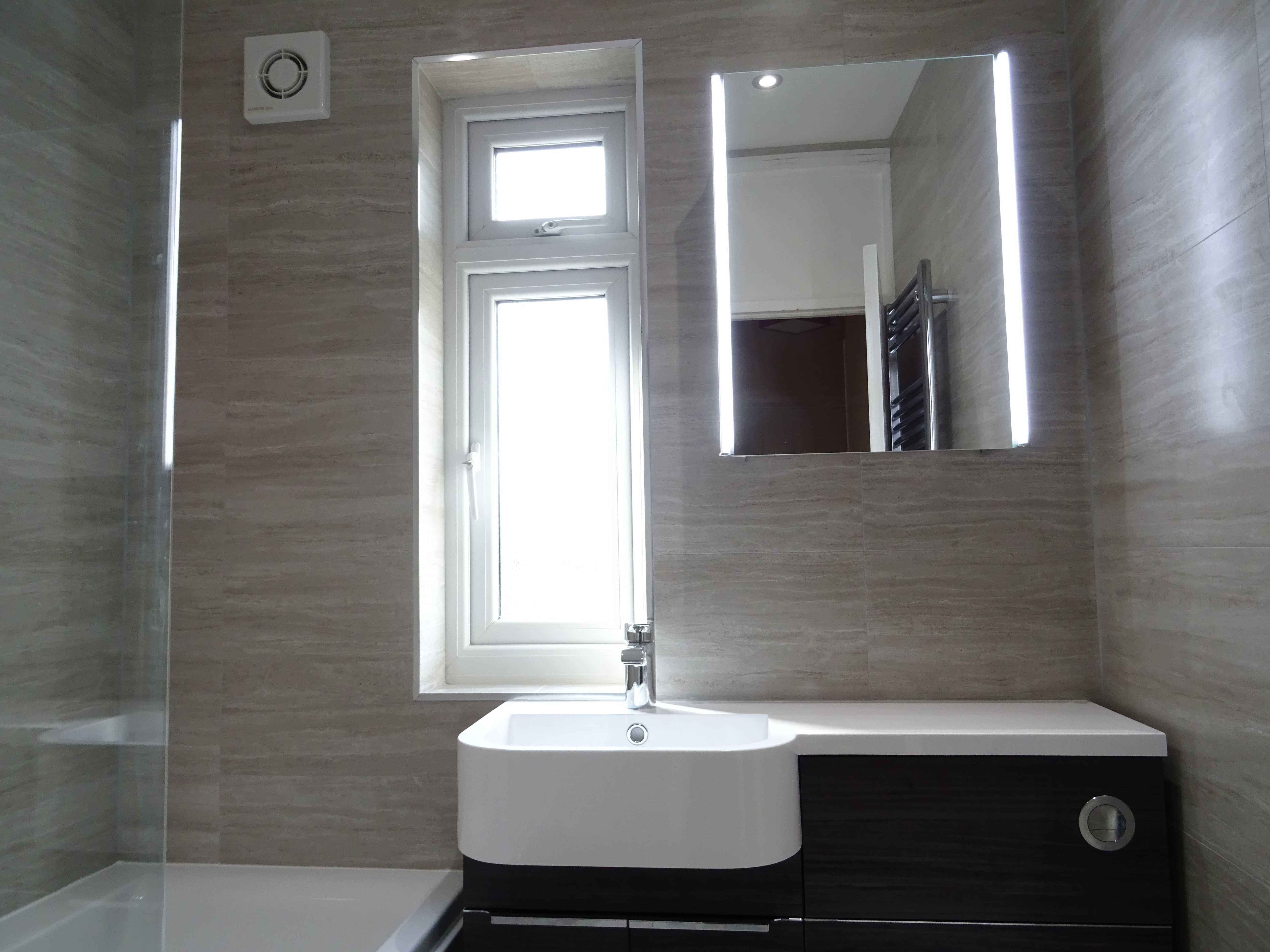 Fitted family bathroom in Coventry with Tavistock Match Tundra wood combined vanity unit