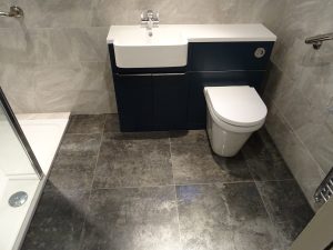 Mobility Shower Room Kenilworth with fully tiled walls and floor