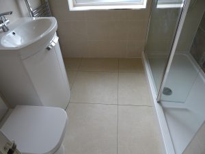 Walk in shower room Kenilworth with cream wall and floor tiles
