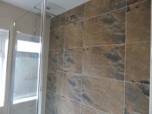 Walk in shower room Kenilworth with feature tiled shower wall