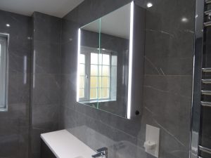 Fully fitted and tiled bathroom Kenilworth with Tavistock sleek led Mirror cabinet