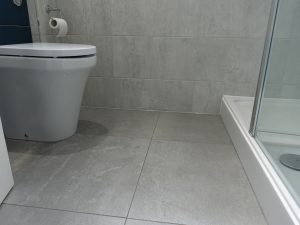 Walls and Floor fully tiled in Walk in Shower Room